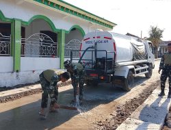 Menjaga Asa di Depan Rumah Ibadah: Kala Satgas TMMD 129 Bojonegoro Setia Merawat Jalan Desa Kesongo